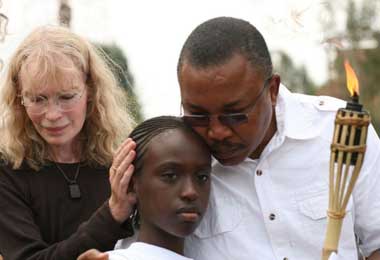 Mia Farrow with a Rwandan girl and Sudanese genocide survivor at the Nyanza Genocide Memorial Site in Kigali