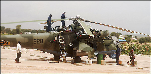 A Russian-supplied Mi-24 helicopter, bearing No. 928, is shown in July at an airport in Geneina, a town in Sudan's Darfur region. Russia provided 12 such aircraft to Sudan in 2005.