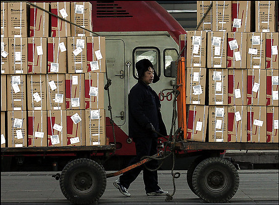 Cargo waits to be loaded onto trains in Beijing. Only about 35 cents from a toy retailing for $20 remains in China
