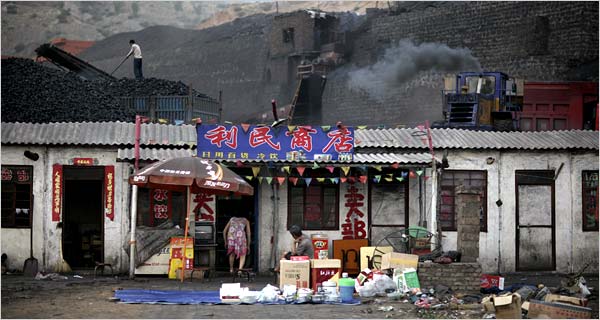 Chinas industrial growth depends on coal, plentiful but polluting, from mines like this one in Shenmu, Shaanxi Province, behind a village store.