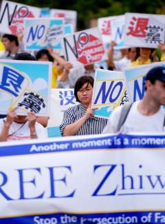 Falun Gong practitioners and supporters marched Friday afternoon through the East Bank