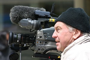 Filmmaker Peter Rowe gathering footage for his documentary Beyond the Red Wall at World Falun Dafa Day activities in Toronto, Canada, in May, 2005. (Jan Jekielek/The Epoch Times)