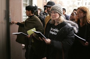 US actress Mia Farrow (C) tries to deliver pamphlets describing genocide in Darfur to China's embassy after leading a march sponsored by The Save Darfur Coalition. The march, through the streets of Washington, DC to the embassy, marked International Human Rights Day with a Dream for Darfur Torch Relay. The march strives to "remind China of its responsibilities" in the Darfur region as it prepares to host the 2008 Olympics. (Saul Loeb/AFP/Getty Images)