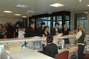 Mr. Wei and Miss Davies talking before the meeting