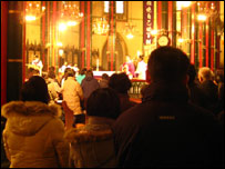 Worshippers attend a service in a state-approved Catholic church