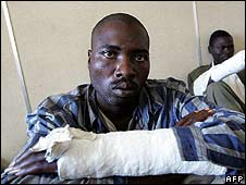 Movement for Democratic Change members allegedly beaten by Mugabe supporters with sticks, May 2008